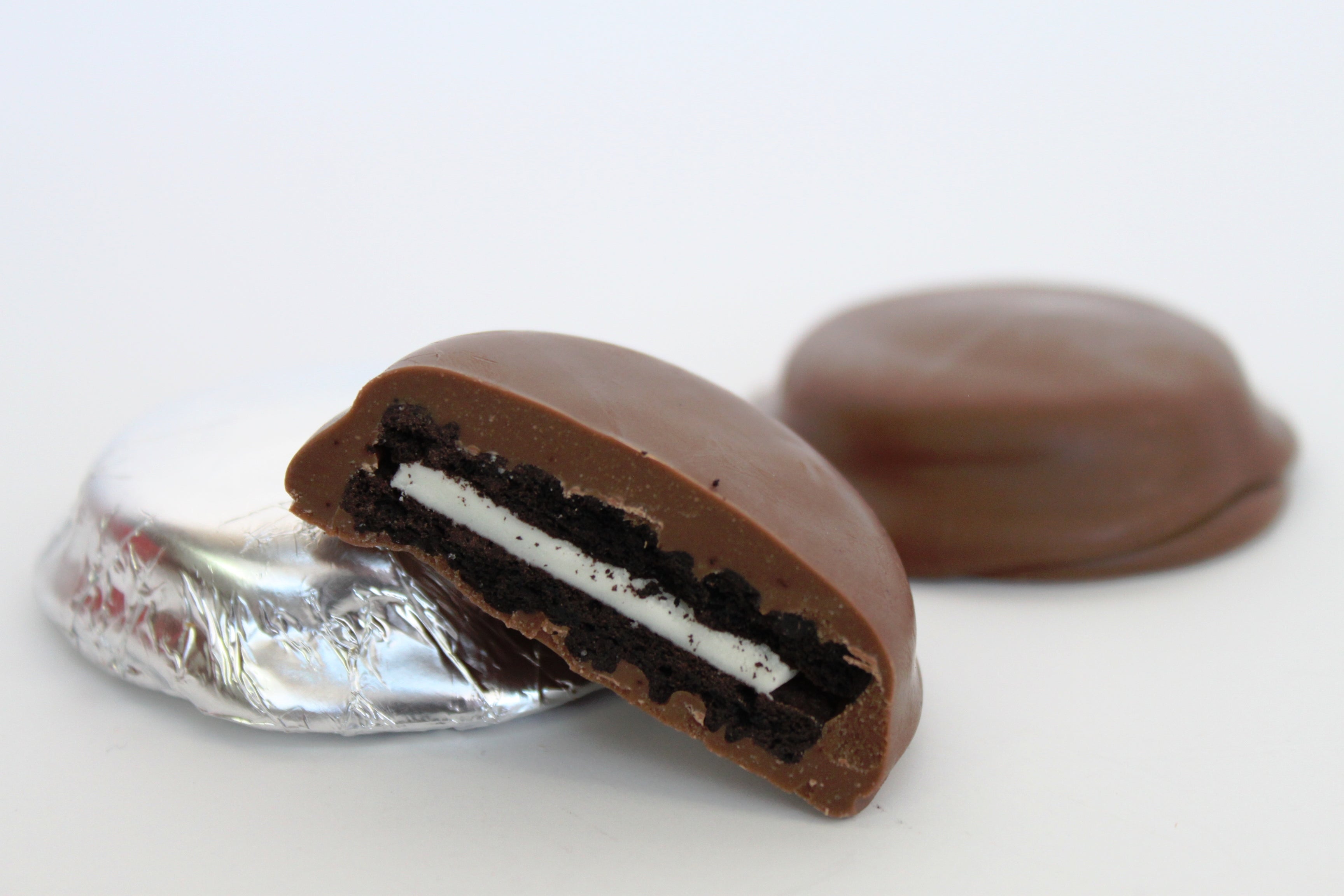 Chocolate-covered Oreo cookie on a white background