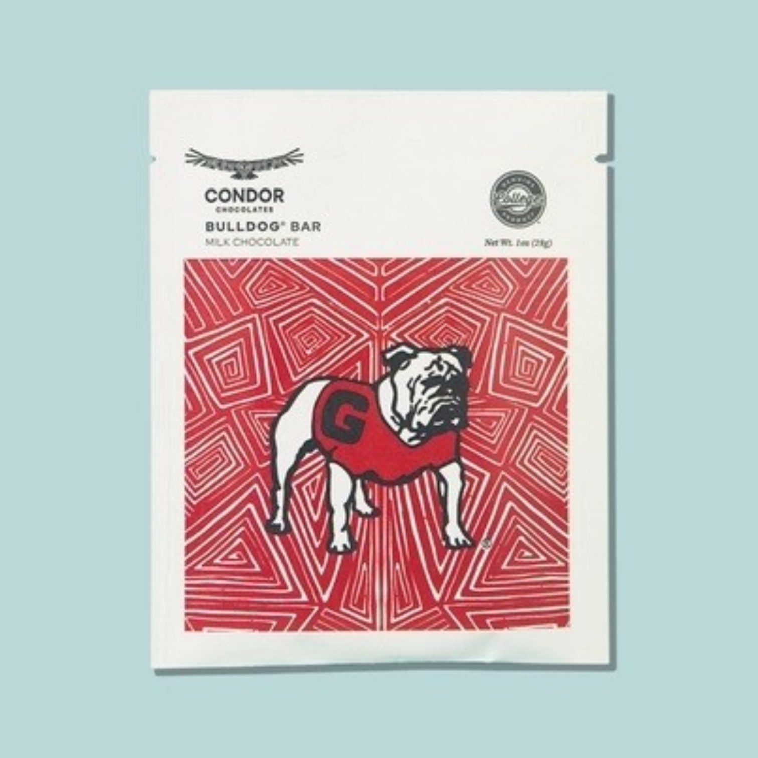A package of Condor Chocolate Bulldog Bar milk chocolate, featuring a white wrapper with a red geometric pattern and an illustration of a bulldog wearing a red jersey with a large &