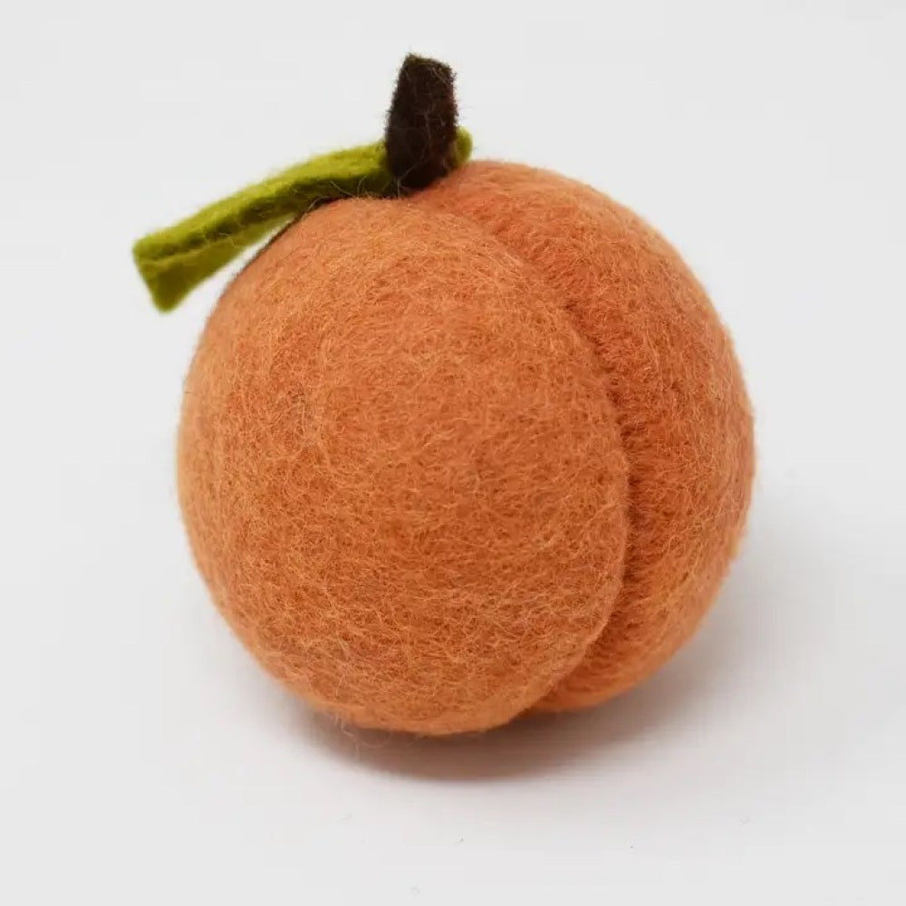 Peach dog toy made of wool