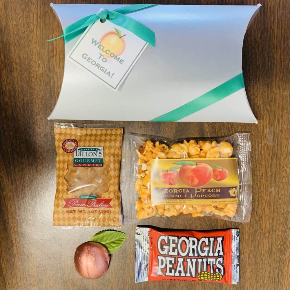 Georgia Greetings Welcome Gift with 4 assorted snacks in a silver envelope