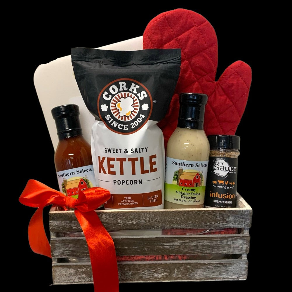 Grill Master BBQ Basket with barbecue sauce, marinade, dry rub, snacks and grill utensils.