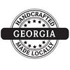 Black and white round stamp-like graphic with 'Handcrafted Georgia Made Locally' text.