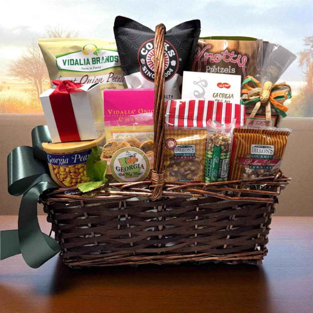 Office party deluxe size in a wicker basket with handle with tin of Georgia peanuts, peanut brittle, praline pecans and other assorted snacks from Georgia