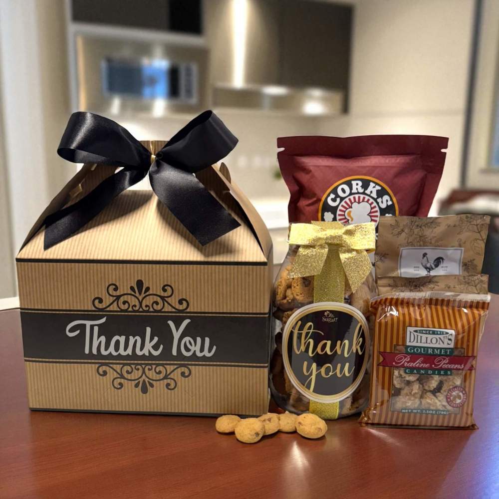 Gourmet Thank You Gift Box features a Thank You gift box filled with Thank You cookies, praline pecans, popcorn and cheese straws.