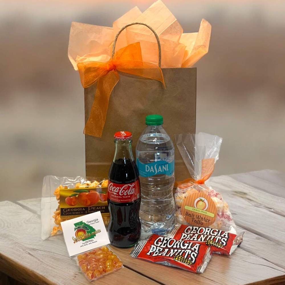 Georgia Welcome Gift Bag with Coca Cola contour bottle, Georgia peanuts and other assorted snacks