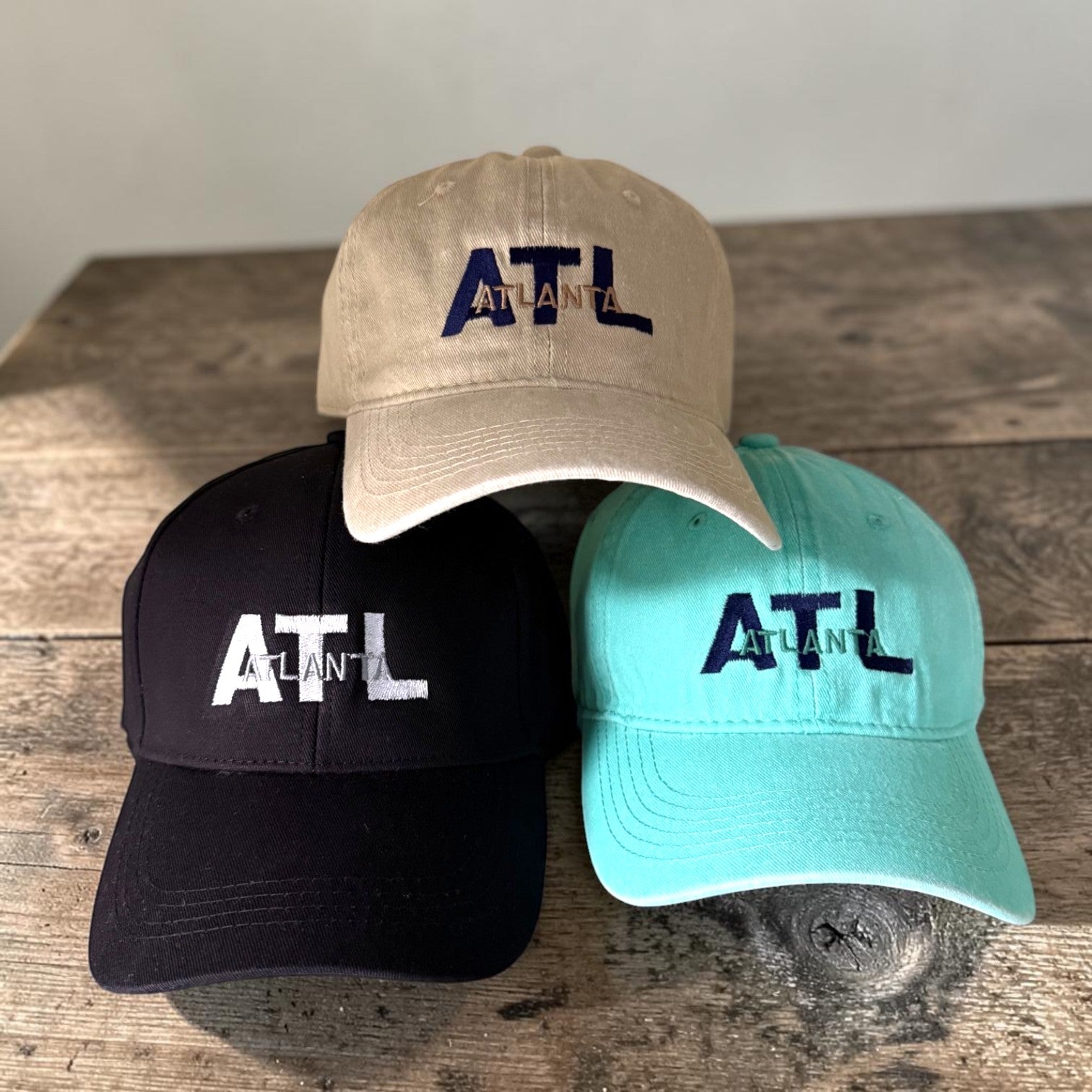 Three baseball caps with &