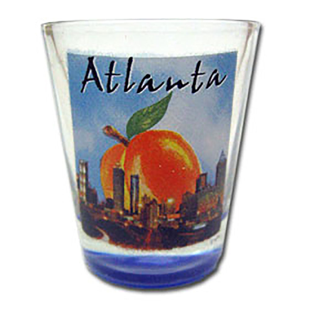 Atlanta shot glass with big peach hovering over the Atlanta skyline