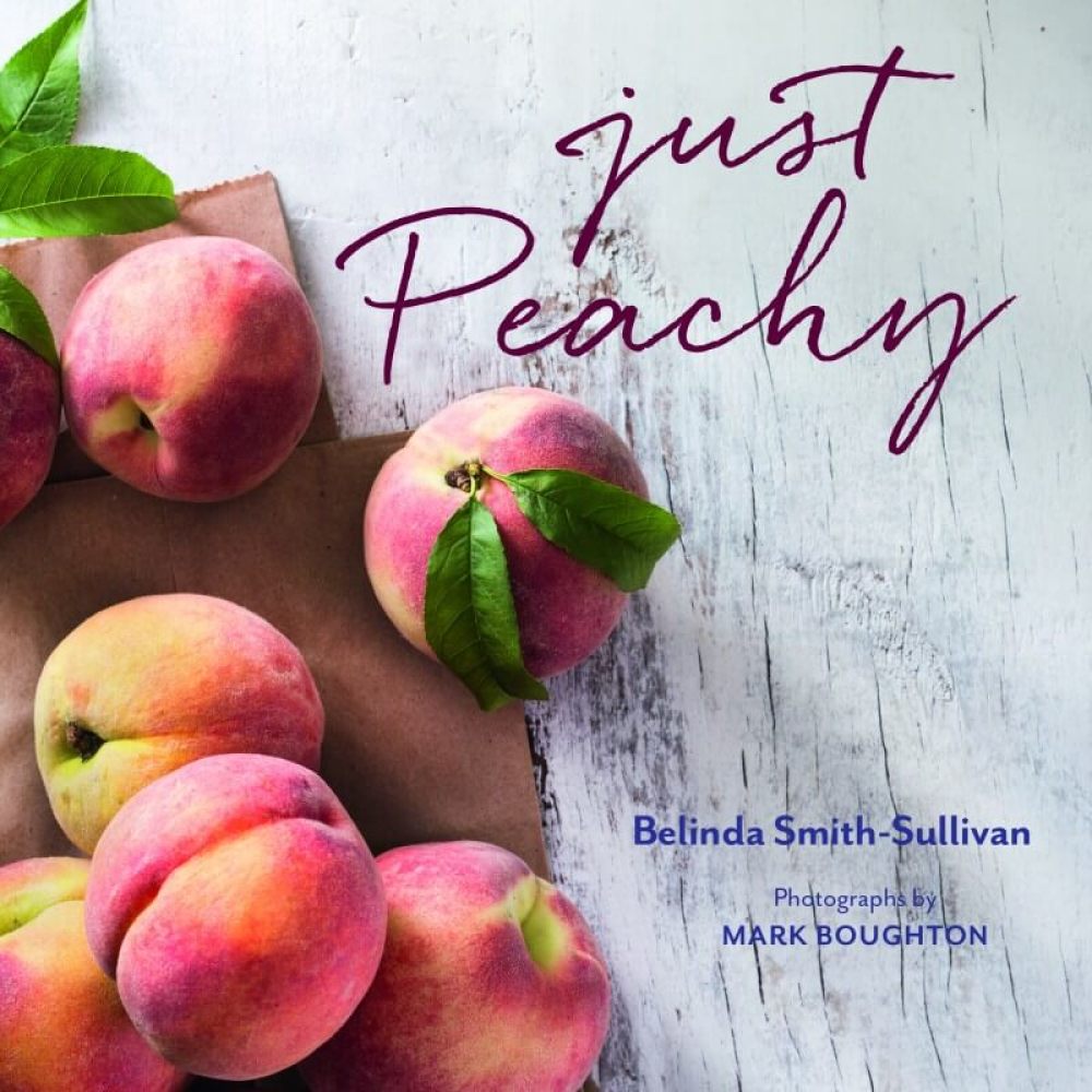 Just Peachy Cookbook with dozens of peaches on the cover