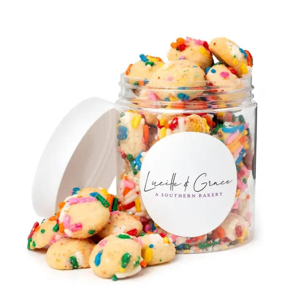 Bite size sugar cookies with sprinkles in a 8 oz jar