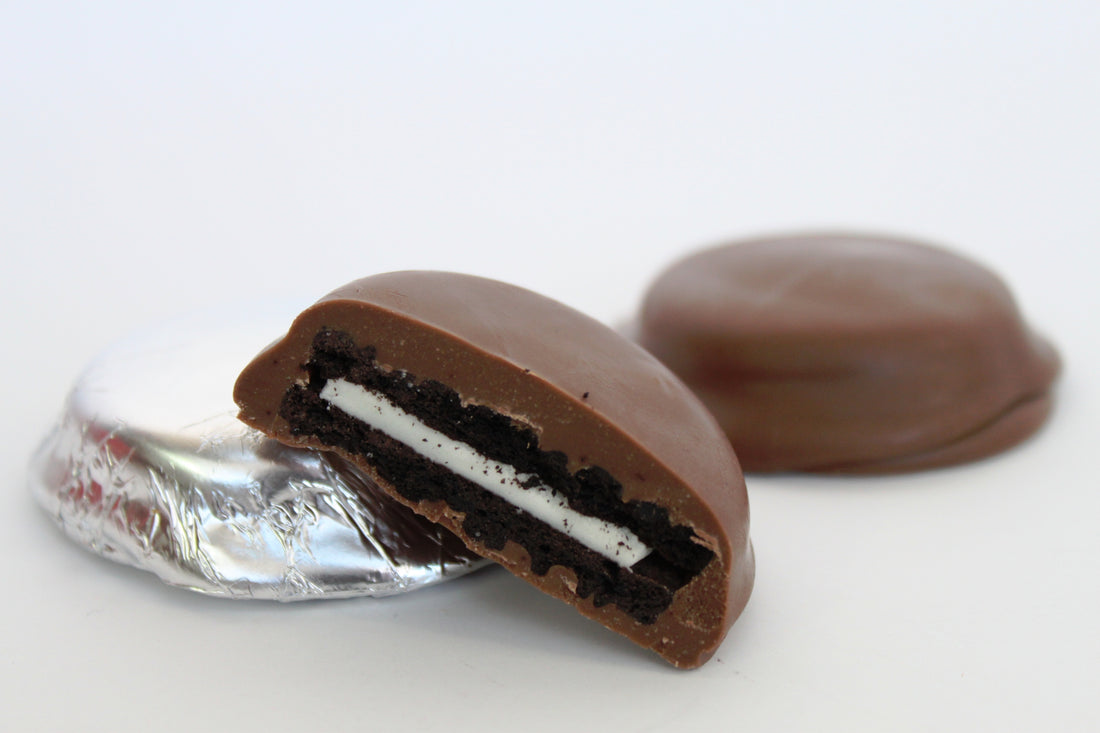 Chocolate-covered Oreo cookie on a white background