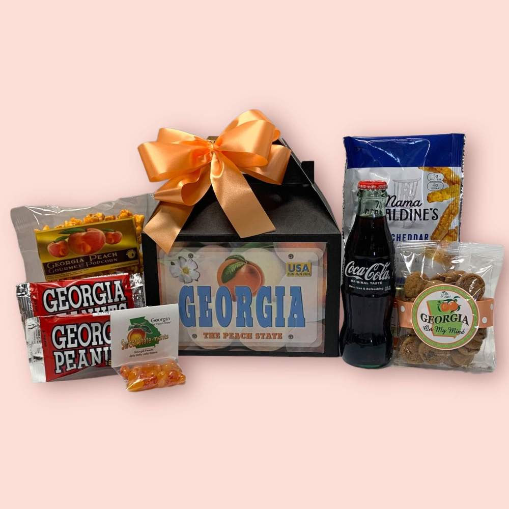 Georgia Welcome Gift Box with contour Coca Cola bottle, Georgia peanuts and assorted snacks from Georgia with Georgia license label on front.