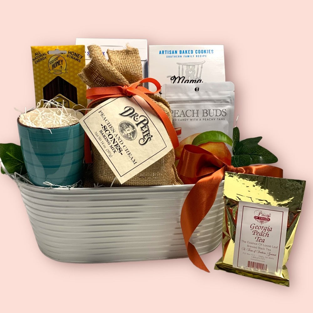 Tea gift basket with honey, scones mix, mug and snacks