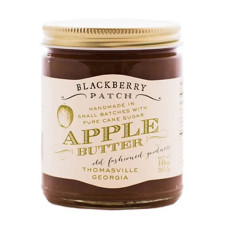Jar of Blackberry Patch Apple Butter with a gold lid on a white background