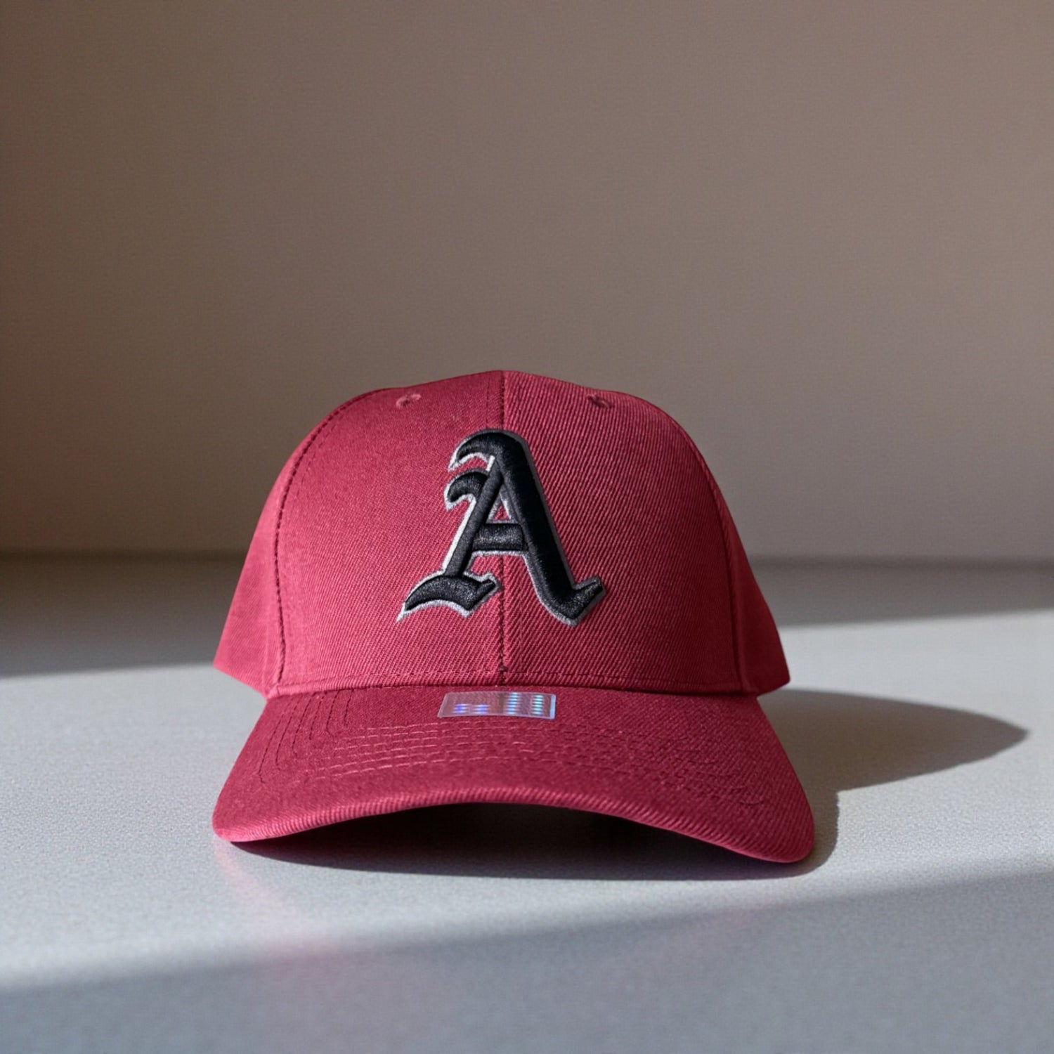 Maroon Atlanta cap with a black letter &