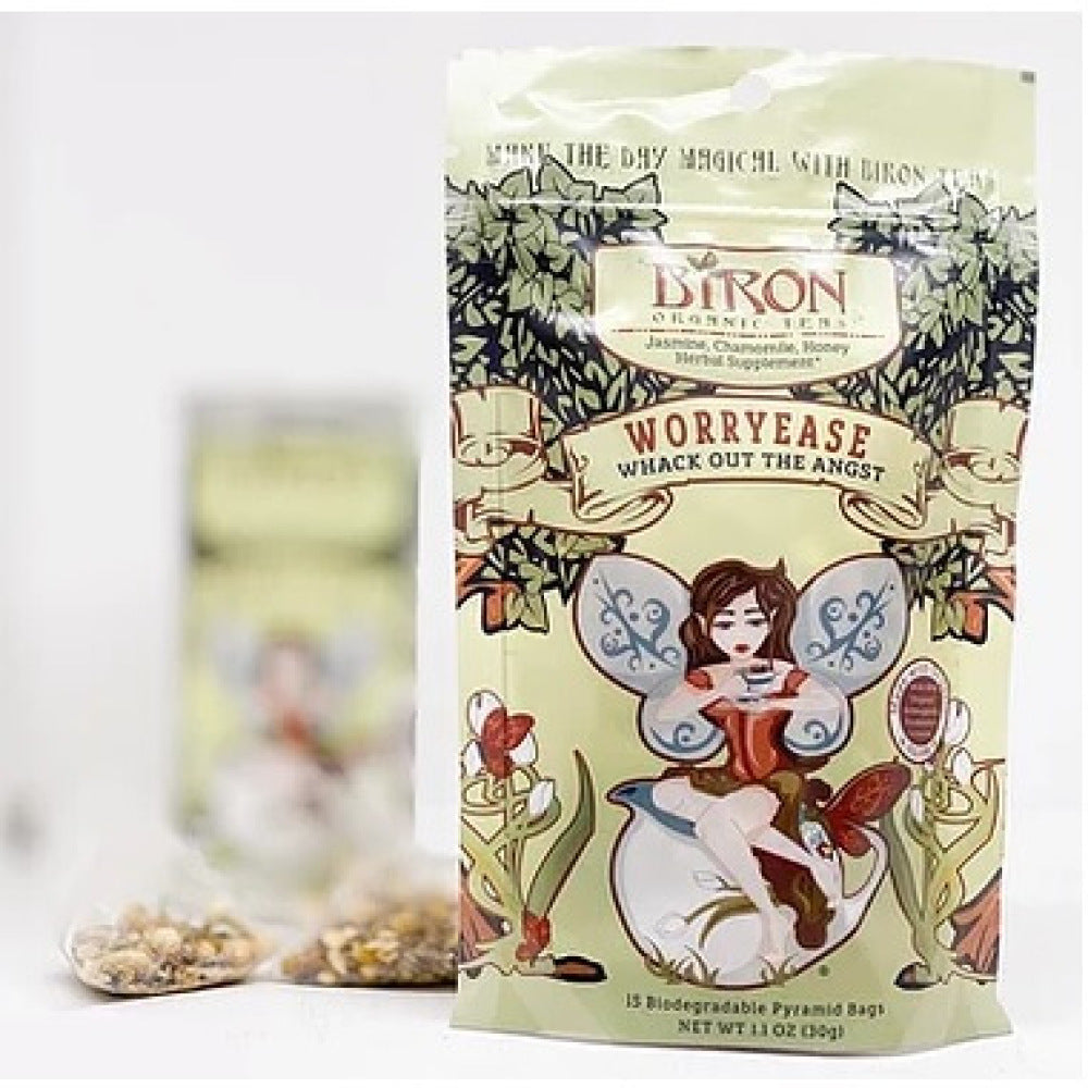 Pouch of Biron Worry Free Tea with fairy design and individual tea bags and tin of tea in the background