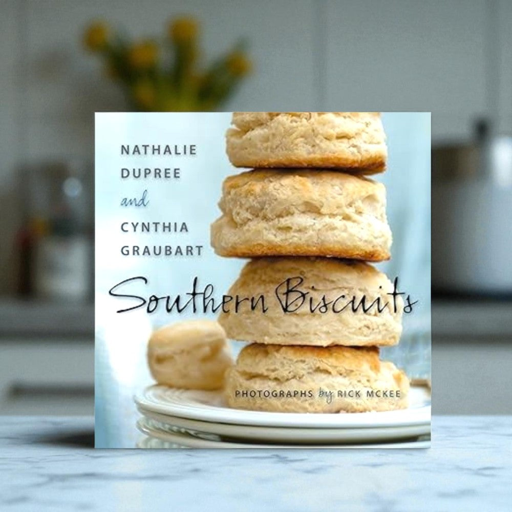 Southern Biscuits Cookbook sitting on marble counter in a kitchen
