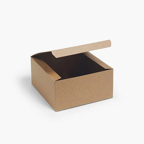 A square kraft colored gift box with its lid propped open, shown on a clean white background.