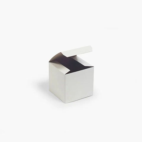 A small open white cardboard box with a folding lid, shown on a clean white background.