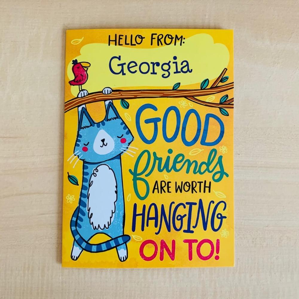 Good Friends Card with cat hanging from a tree