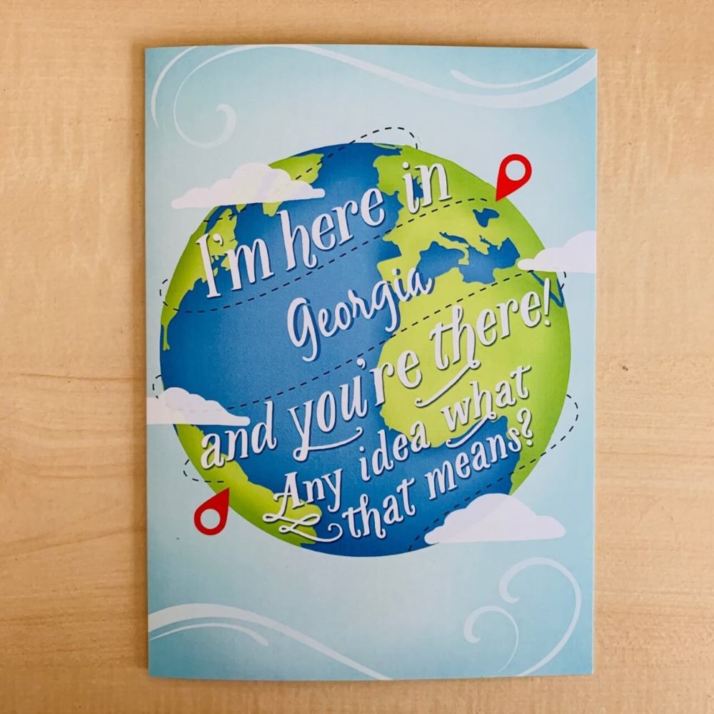 Wrong Place Georgia greeting card with white wording a globe on the front.