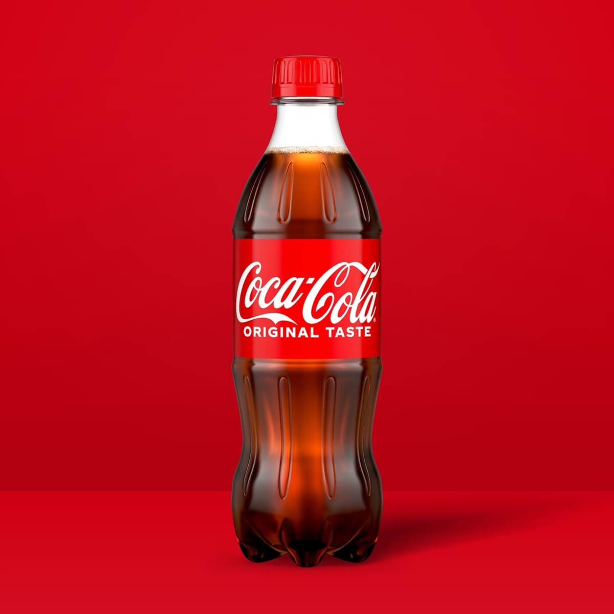 Coca-Cola bottle with red label on a red background