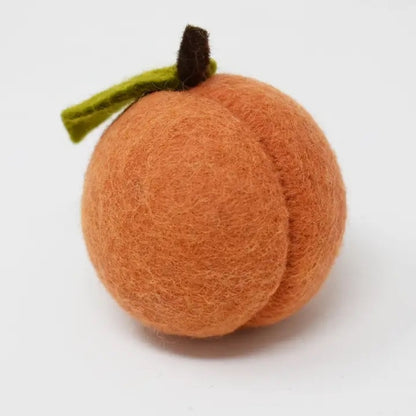 Peach dog toy made of wool