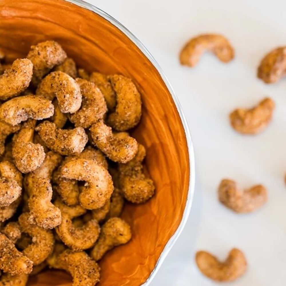 Premium cashews with a sugar and spice coating presented on a plate