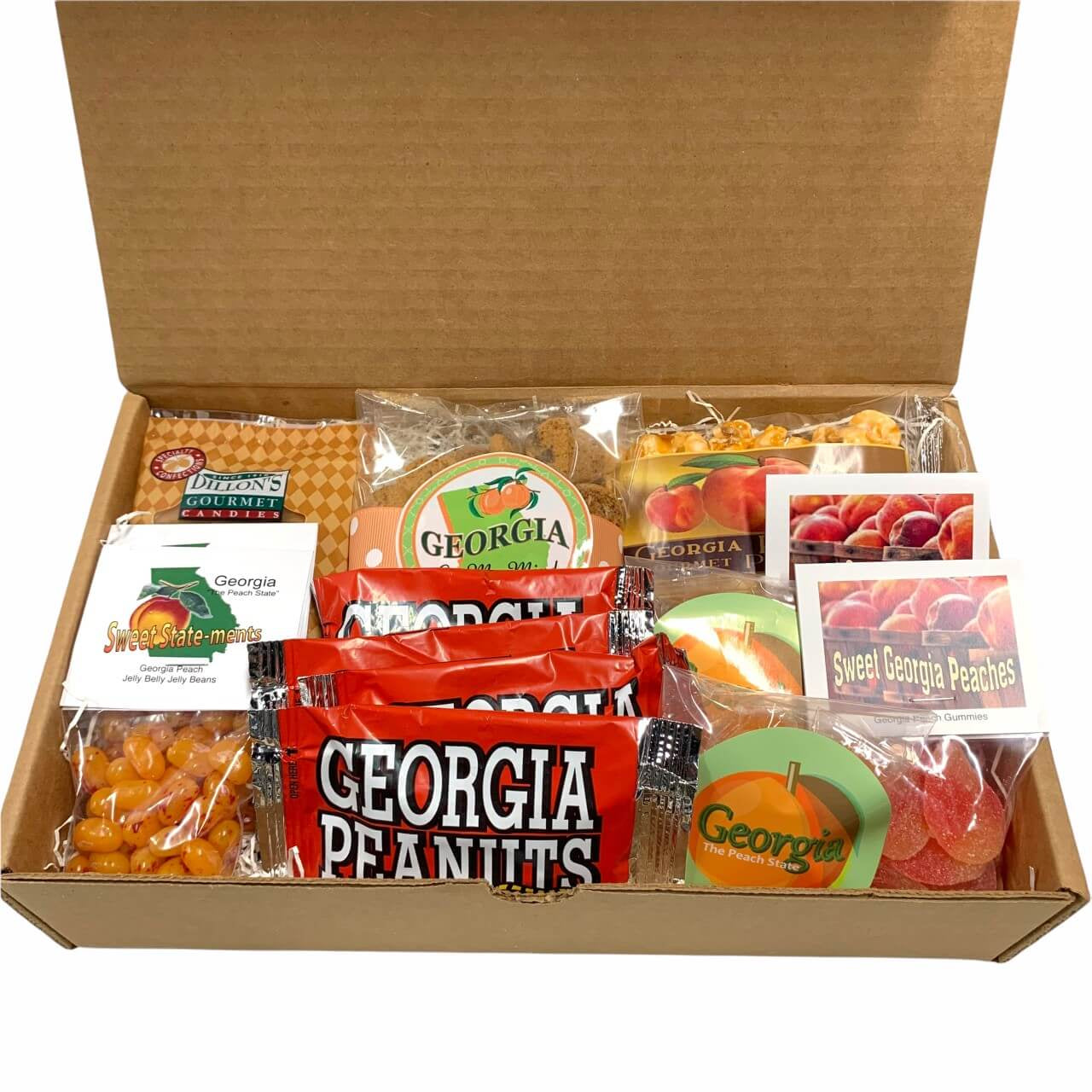 Open cardboard box filled with Georgia-themed snacks and candies on a white background