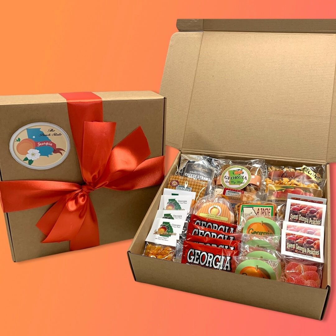 Gift box with snacks and Georgia-themed packaging on an orange background