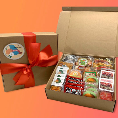 Gift box with snacks and Georgia-themed packaging on an orange background