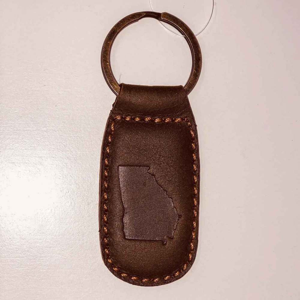 Dark brown leather key chain with the state of Georgia outline embossed on the front.