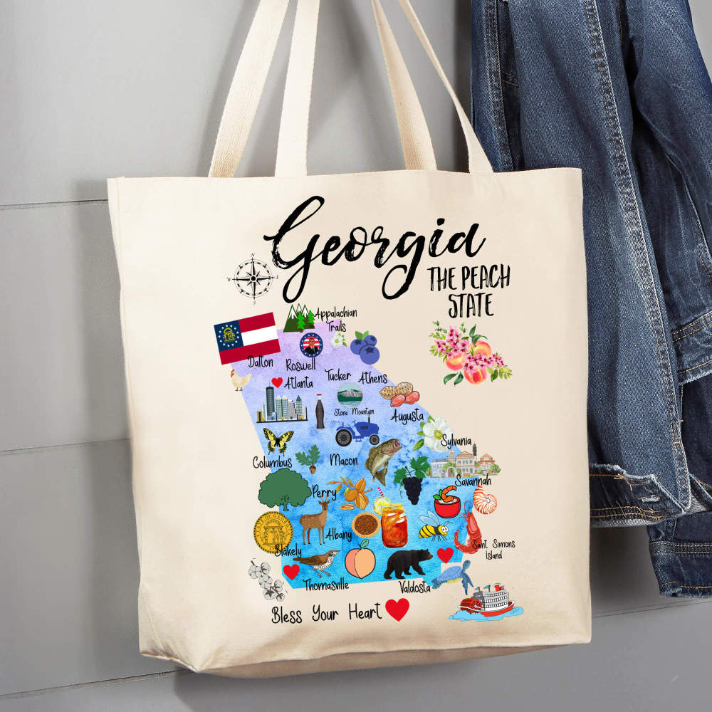Natural canvas tote bag featuring a colorful state map with cities and icons