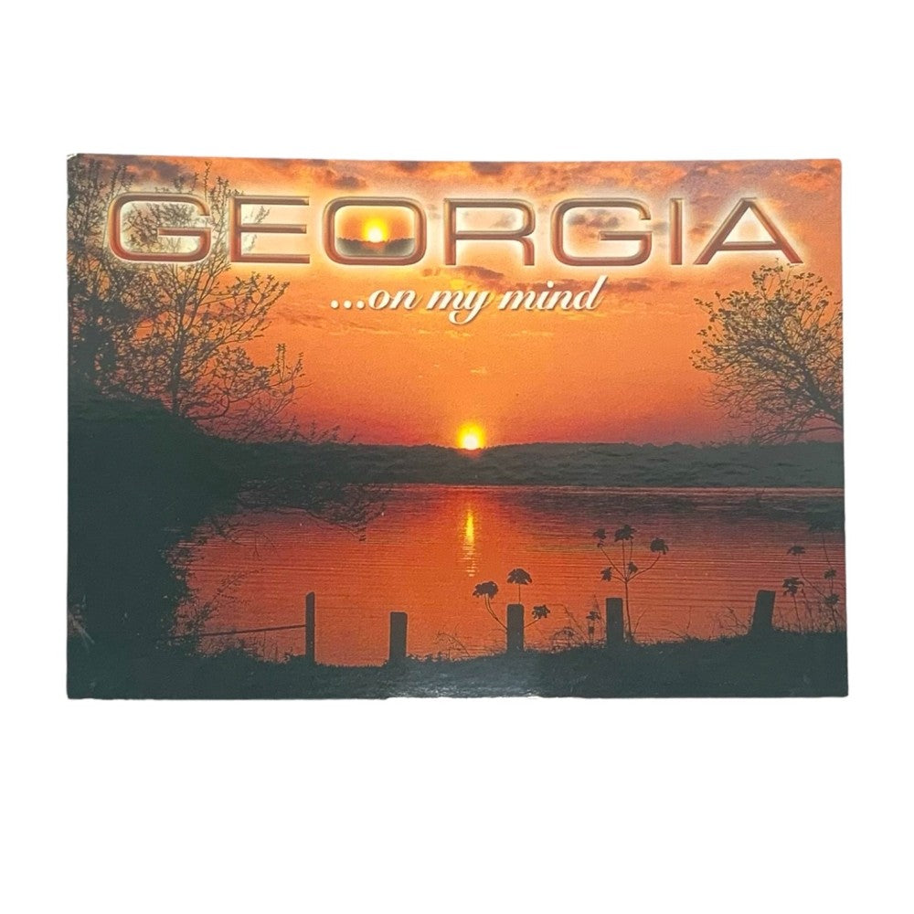 Georgia postcard features the sun setting on a lake in Georgia