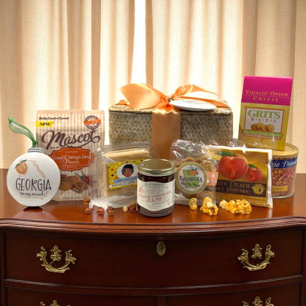 Assortment of Georgia foods and snacks in front of a woven chest with keepsake Georgia ornament