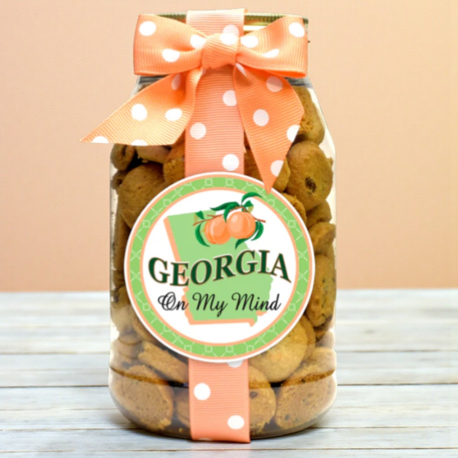 Jar of cookies with a decorative ribbon and &