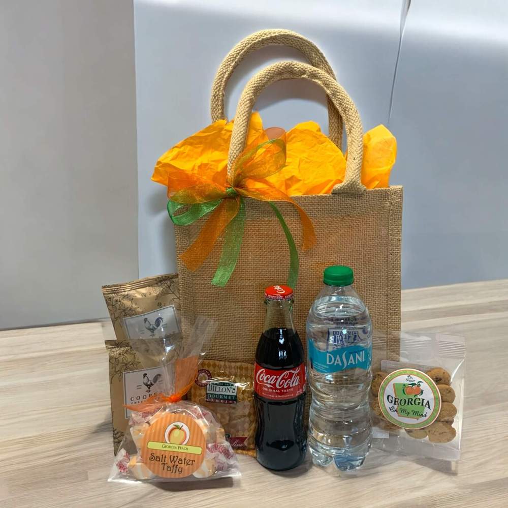 Georgia Welcome Burlap Bag with Coca Cola contour bottle and assorted snacks