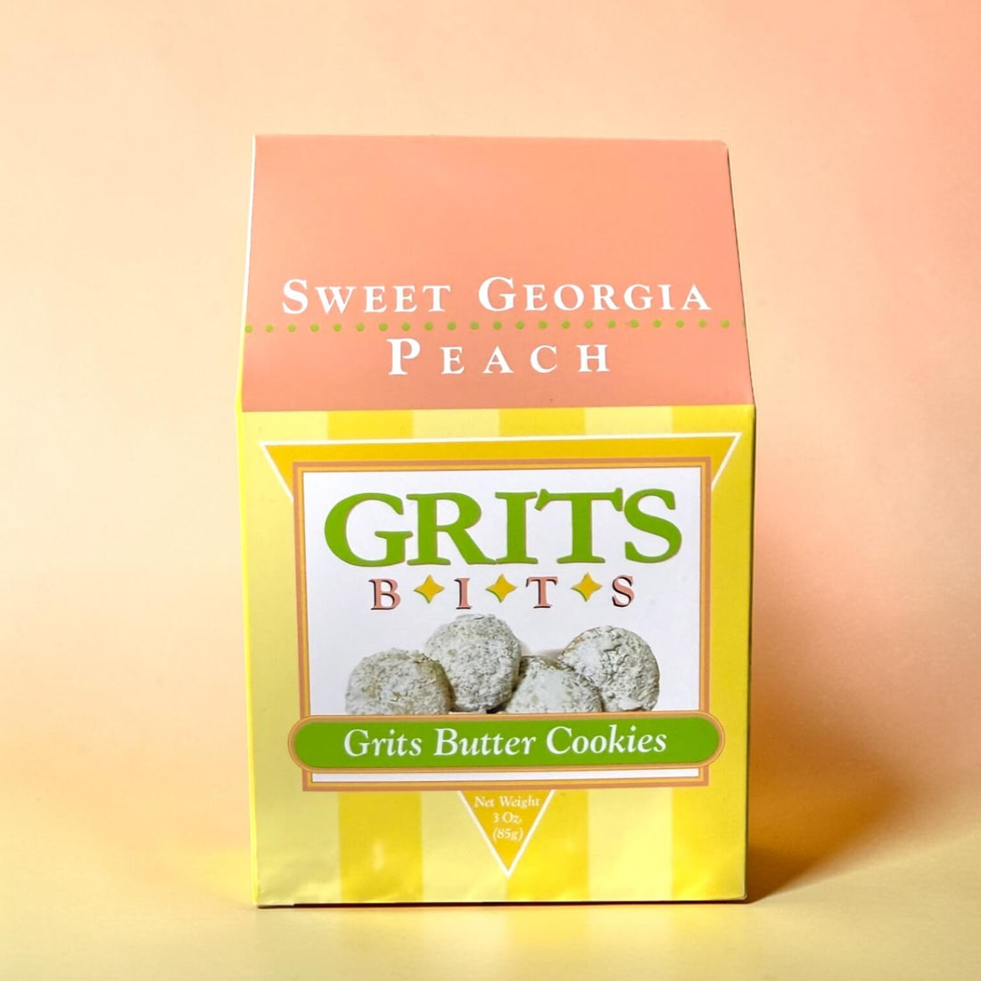 Box of Sweet Georgia Peach Grits Bits Grits Butter Cookies on a peach background