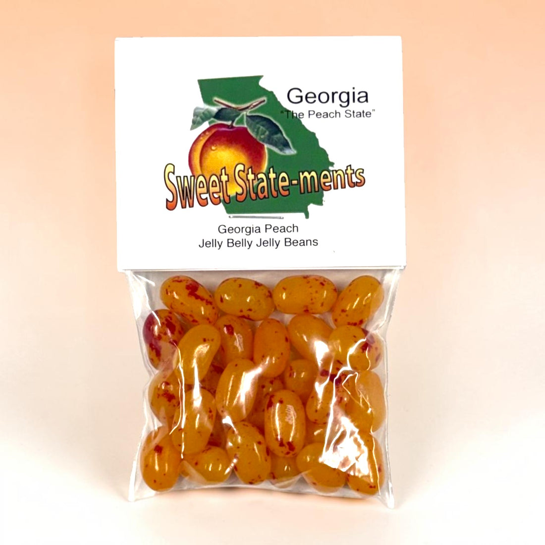 Packaged Georgia peach jelly beans with a clear bag on a peach background