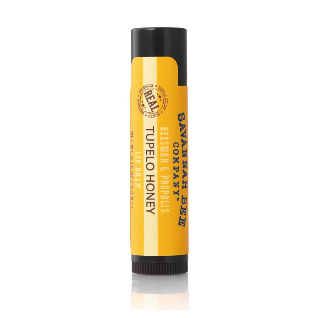 Savannah Bee Tupelo Honey Lip balm with yellow label and black cap on a white background
