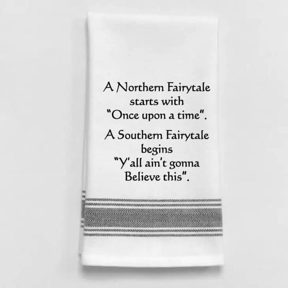 Fun white kitchen towel with black imprint and trim about a Northern fairytale.