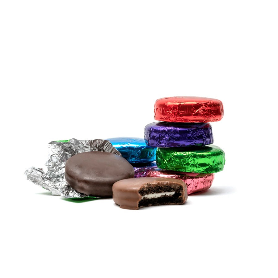 Colorful chocolate-covered cookies wrapped in various foil colors on a white background