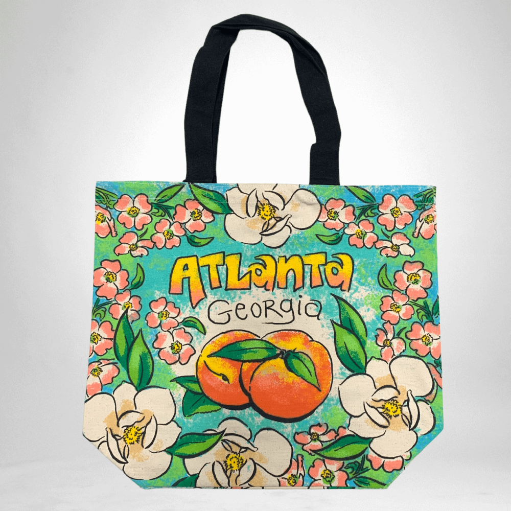 Canvas Atlanta tote bag with brightly colored flowers, Georgia peaches and the city name Atlanta.