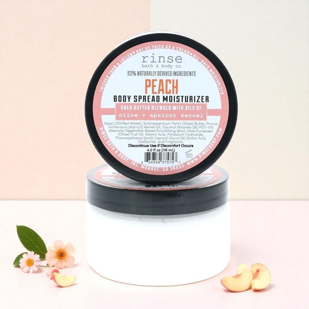 Jar of peach body butter moisturizing cream