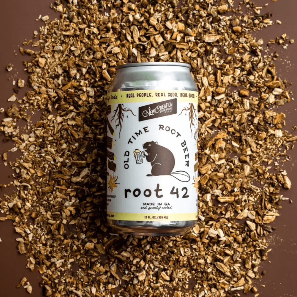Can of Root 42 old fashioned root beer with chopped nuts in the background.