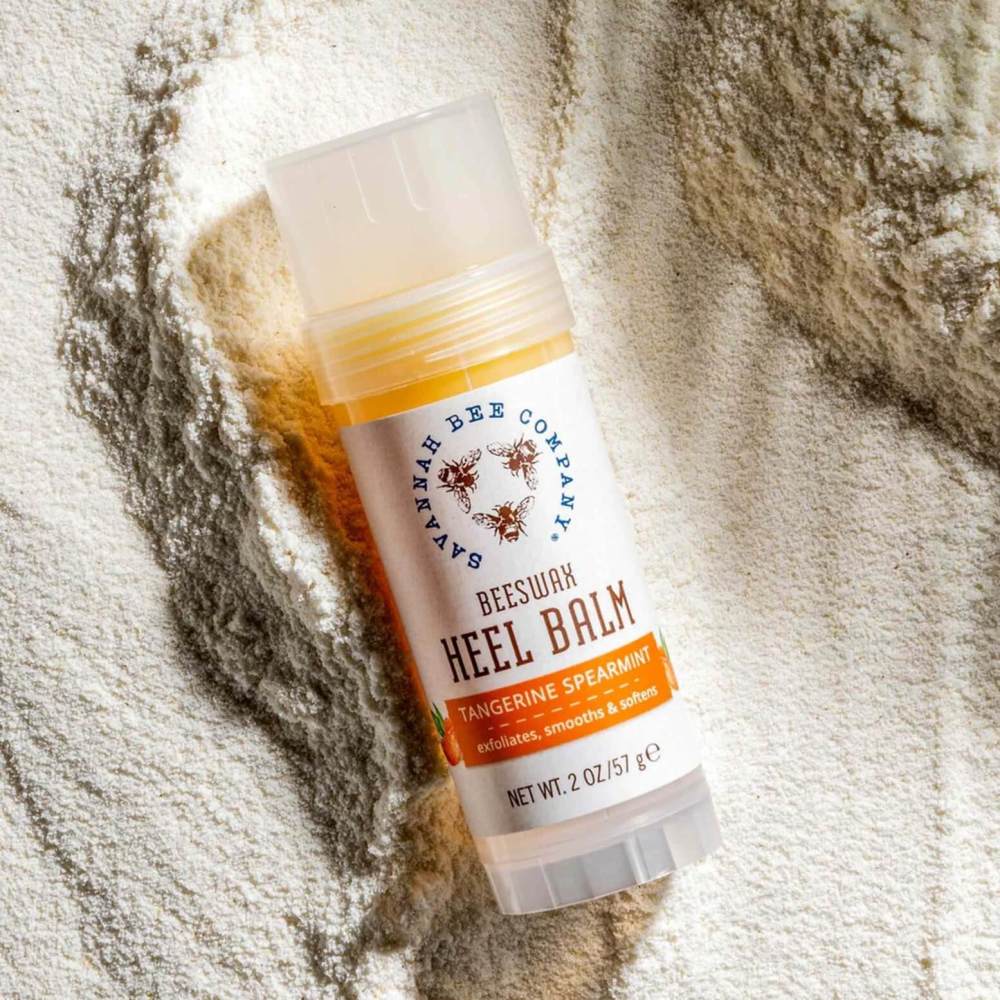 2.5 ounce tube of Savannah Bee heel balm on beige towel
