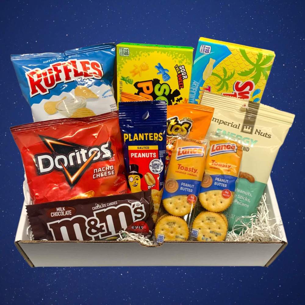 White gift box filled with chips, candies, nuts and more