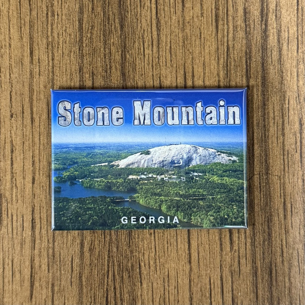 Aerial view of Stone Mountain park with lush greenery around the mountain.