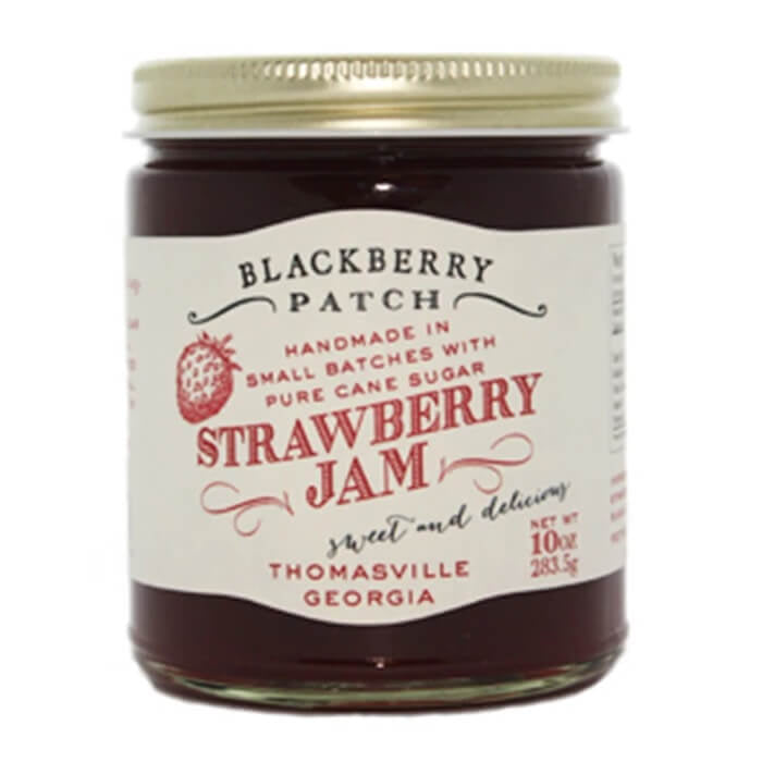 Jar of Blackberry Patch Strawberry Jam with a white label on a white background