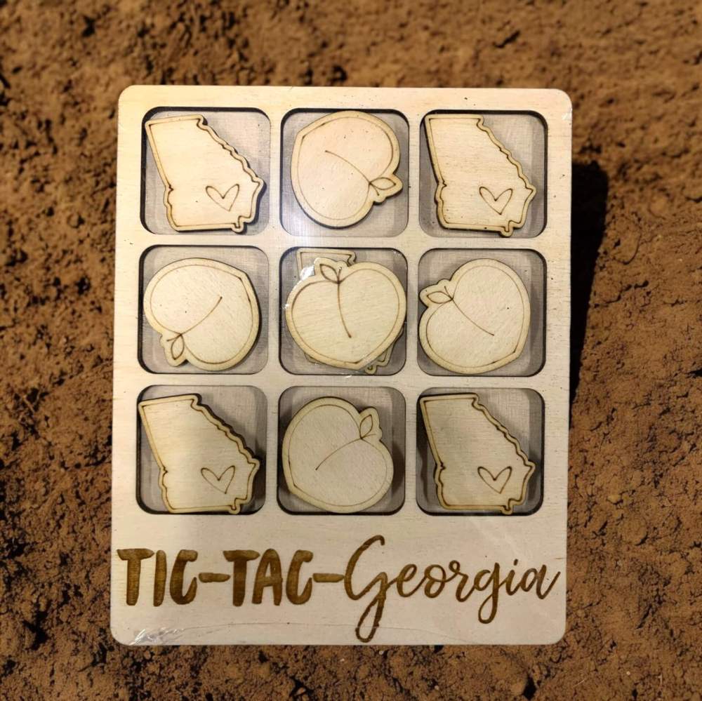 Wooden tic-tac-toe game for Georgia with laser cut peaches and state of Georgia marker pieces