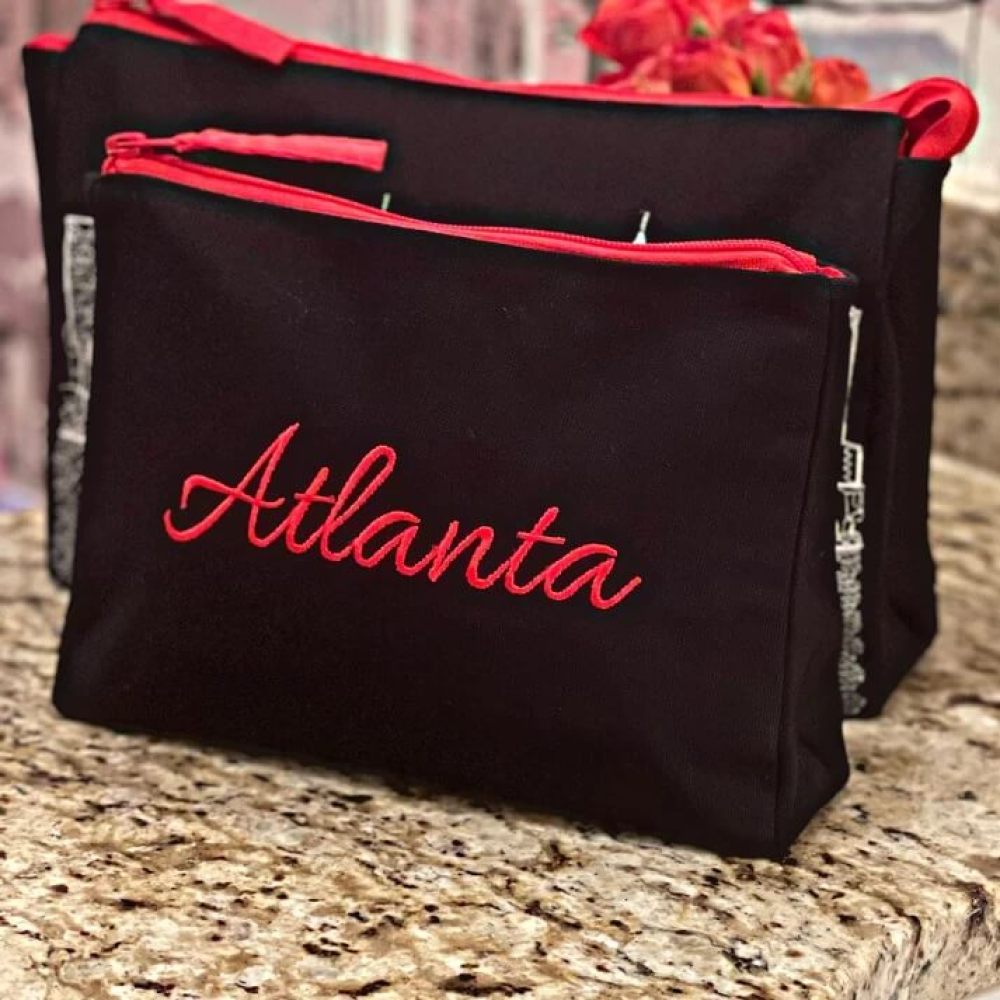 Black bags with red zipper and &